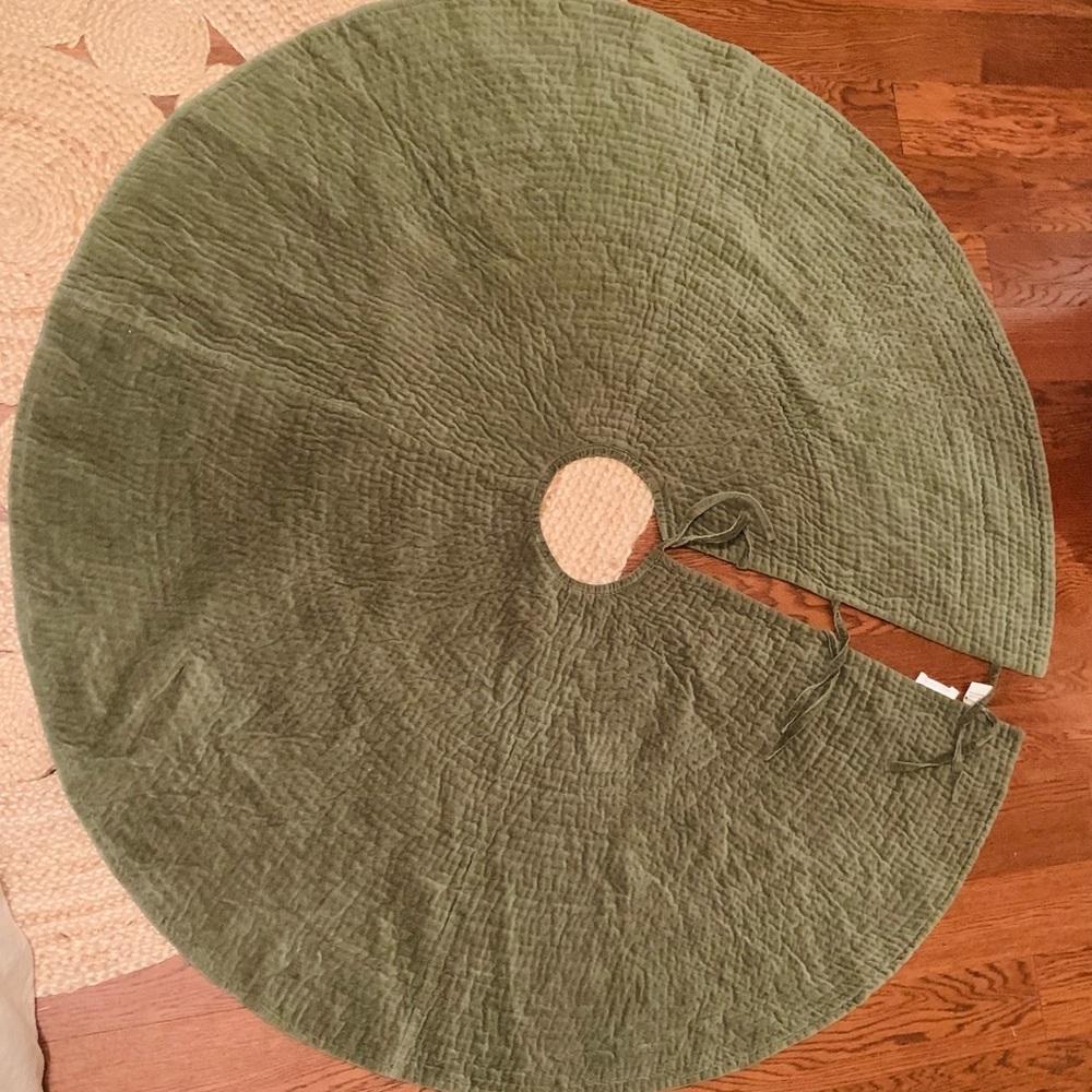 Green velvet Pottery Barn tree skirt with ties. 57 inches in diameter.
